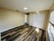 Cozy bedroom with laminate flooring, a closet, and a large window at 3 Pine Radial Ln, Ocala, FL 34472