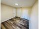 Cozy bedroom with laminate flooring, a closet, and a large window at 3 Pine Radial Ln, Ocala, FL 34472