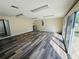Spacious bonus room with sliding glass doors, recessed lighting and wood-look flooring at 3 Pine Radial Ln, Ocala, FL 34472