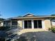 Exterior shot of the garage with a driveway and unique architectural details, and sliding doors at 3 Pine Radial Ln, Ocala, FL 34472