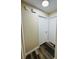 Hallway features neutral walls and mixed-tone wood-look flooring, plus a ceiling light and safety devices at 3 Pine Radial Ln, Ocala, FL 34472