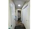Hallway features neutral walls and mixed-tone wood-look flooring, plus a ceiling light at 3 Pine Radial Ln, Ocala, FL 34472