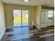 Bright kitchen featuring a sliding door and refrigerator at 3 Pine Radial Ln, Ocala, FL 34472