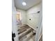 Laundry room features neutral walls, wire shelving, connections, and wood-look flooring at 3 Pine Radial Ln, Ocala, FL 34472