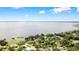 A captivating lakefront property with lush landscaping and stunning panoramic views of the serene lake at 4237 Chambers St, Lake Wales, FL 33898