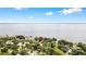 Beautiful lake view property featuring mature trees, well-manicured lawns and gorgeous views of a pristine lake at 4237 Chambers St, Lake Wales, FL 33898