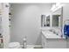 Bathroom featuring a white vanity with a granite countertop, and a toilet at 4237 Chambers St, Lake Wales, FL 33898