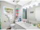 Clean bathroom with a white vanity, ample lighting, and colorful decor at 4237 Chambers St, Lake Wales, FL 33898