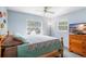 Bedroom with two windows, hardwood floors, and a lake view at 4237 Chambers St, Lake Wales, FL 33898