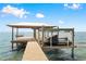 Covered boat dock with Jet Ski lift and swing at 4237 Chambers St, Lake Wales, FL 33898