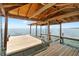 Inside view of covered boat dock with hanging swing at 4237 Chambers St, Lake Wales, FL 33898