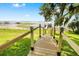 New wooden dock with black post cap lights and lake views beyond at 4237 Chambers St, Lake Wales, FL 33898