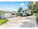 Charming two-story home with a spacious driveway, well-maintained landscaping, and a detached two-car garage at 4237 Chambers St, Lake Wales, FL 33898