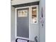Charming front door with sidelight, decorative accents, and 'Lake House' welcome mat, adding character and warmth at 4237 Chambers St, Lake Wales, FL 33898