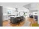 Spacious kitchen with island, stainless steel appliances, and an open layout flowing into a dining area and living space at 4237 Chambers St, Lake Wales, FL 33898