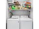 Laundry room with modern washer and dryer, plus shelving for storage at 4237 Chambers St, Lake Wales, FL 33898