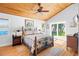 Main bedroom with wood ceiling, ceiling fan, and outdoor access at 4237 Chambers St, Lake Wales, FL 33898