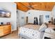 Main bedroom featuring a wood ceiling, dresser and television at 4237 Chambers St, Lake Wales, FL 33898