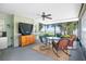 Enclosed porch with lake views and comfortable seating at 4237 Chambers St, Lake Wales, FL 33898