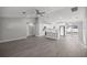 Bright, open-concept living room and kitchen features stainless steel appliances and sleek, modern finishes at 53 Hemlock Trail, Ocala, FL 34472