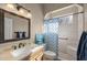 Bathroom featuring modern vanity, shower with patterned curtain, and natural light at 5425 Se 44Th Cir, Ocala, FL 34480