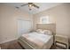 Cozy bedroom featuring plush carpet, ceiling fan and closet at 5425 Se 44Th Cir, Ocala, FL 34480