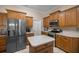 Modern kitchen with stainless steel appliances, a center island, and plenty of cabinets at 5425 Se 44Th Cir, Ocala, FL 34480