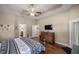 Spacious main bedroom with trey ceiling, hardwood floors and walk-in closet at 5425 Se 44Th Cir, Ocala, FL 34480