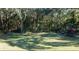 Lush playground area with picnic tables and play equipment for recreational enjoyment in a natural setting at 5425 Se 44Th Cir, Ocala, FL 34480