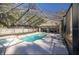 Aerial view of the screened-in pool and spa with an expansive backyard at 5425 Se 44Th Cir, Ocala, FL 34480