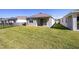 A large backyard features lush lawn and metal fence at 5430 Nw 46Th Lane Rd, Ocala, FL 34482