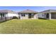 Spacious backyard features lush grass and a metal fence, perfect for outdoor enjoyment at 5430 Nw 46Th Lane Rd, Ocala, FL 34482