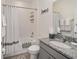 Well-lit bathroom featuring a shower-tub combo and modern fixtures at 5430 Nw 46Th Lane Rd, Ocala, FL 34482
