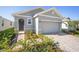 Well maintained home shows front door, two-car garage, and manicured front yard at 5430 Nw 46Th Lane Rd, Ocala, FL 34482