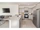 Eat-in kitchen with stainless appliances, granite countertops, and backyard view at 5430 Nw 46Th Lane Rd, Ocala, FL 34482