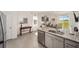 Kitchen features stainless appliances, granite countertops, and backyard views at 5430 Nw 46Th Lane Rd, Ocala, FL 34482
