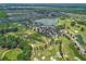 Expansive aerial view of the community featuring a golf course, lake, pool, and residential area at 5616 Nw 39Th Ln, Ocala, FL 34482