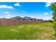 Spacious backyard featuring a well-maintained lawn and a secure, decorative privacy fence for outdoor enjoyment at 5616 Nw 39Th Ln, Ocala, FL 34482