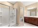 Bathroom showcasing a walk-in shower, vanity with sink, and tiled floors at 5616 Nw 39Th Ln, Ocala, FL 34482