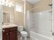 Bathroom featuring a shower-tub combo, vanity with drawers, and neutral finishes at 5616 Nw 39Th Ln, Ocala, FL 34482