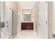 Bathroom with a walk-in shower, double sink vanity, tile floors, and neutral finishes at 5616 Nw 39Th Ln, Ocala, FL 34482
