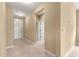 A bright foyer with tiled floors and neutral-colored walls, creating a welcoming entrance at 5616 Nw 39Th Ln, Ocala, FL 34482