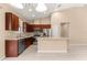Bright kitchen features stainless steel appliances, tiled floors, and ample counter space at 5616 Nw 39Th Ln, Ocala, FL 34482