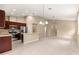 Open-concept living area flows into a kitchen with stainless appliances and a center island at 5616 Nw 39Th Ln, Ocala, FL 34482