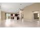Open-concept living area with tiled floors and lots of sunlight, offering views of the backyard at 5616 Nw 39Th Ln, Ocala, FL 34482