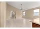 This large, open living room offers neutral walls, tile floors, and plenty of natural light at 5616 Nw 39Th Ln, Ocala, FL 34482