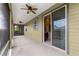 View of the screened lanai with access to the interior, and ceiling fans for comfort at 5616 Nw 39Th Ln, Ocala, FL 34482