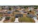 Expansive aerial view of a residential neighborhood featuring neatly arranged homes and well-maintained lawns at 60 Walnut Dr, Ocala, FL 34480