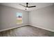 The bedroom features modern floors, neutral walls, and a bright window at 60 Walnut Dr, Ocala, FL 34480