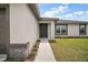 Home's front exterior featuring manicured landscaping, and inviting entrance at 60 Walnut Dr, Ocala, FL 34480